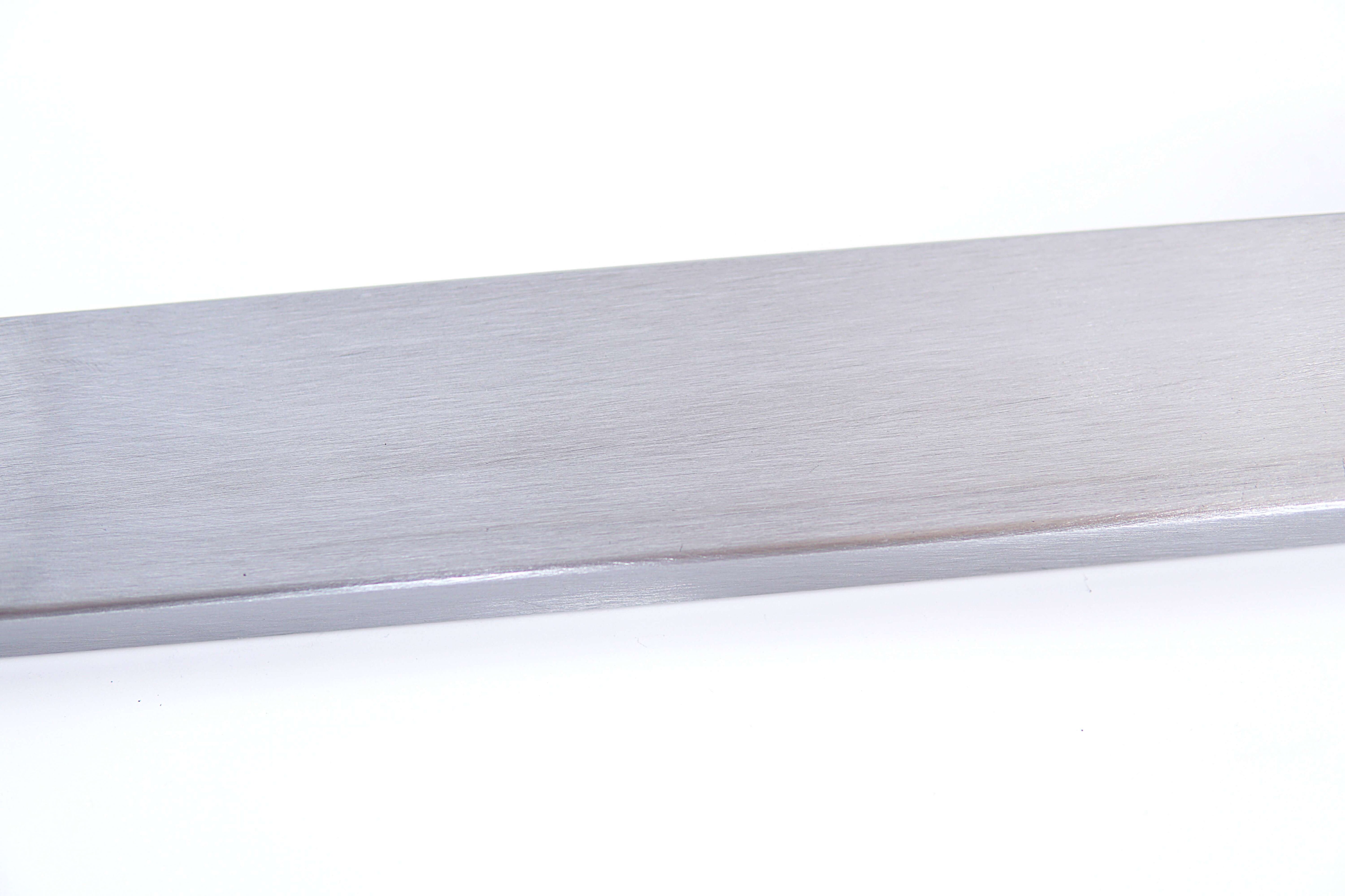 Silver metal table leg support, narrow trapezoid frame crossbar close-up