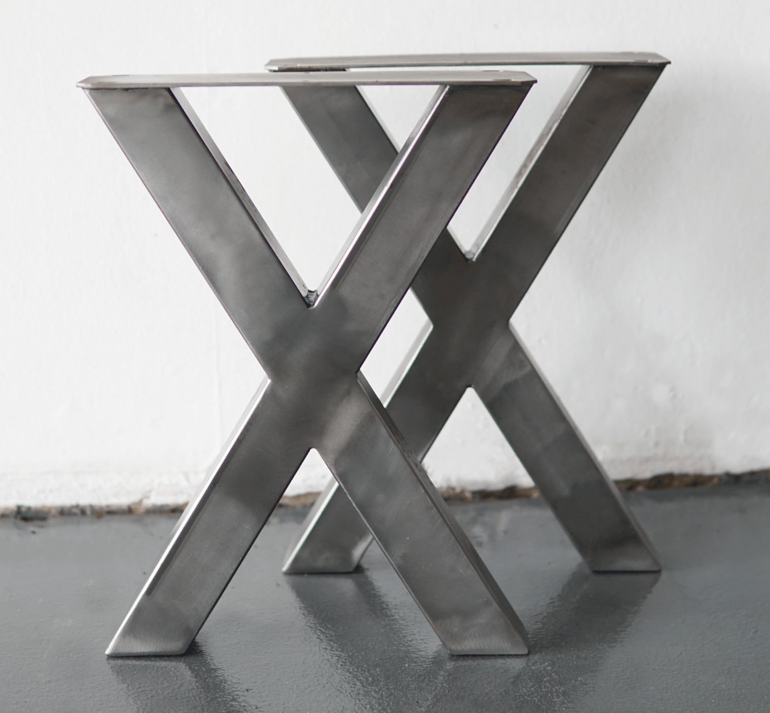 Sturdy bench X legs with dark metal cross-bracing and top mounting holes.