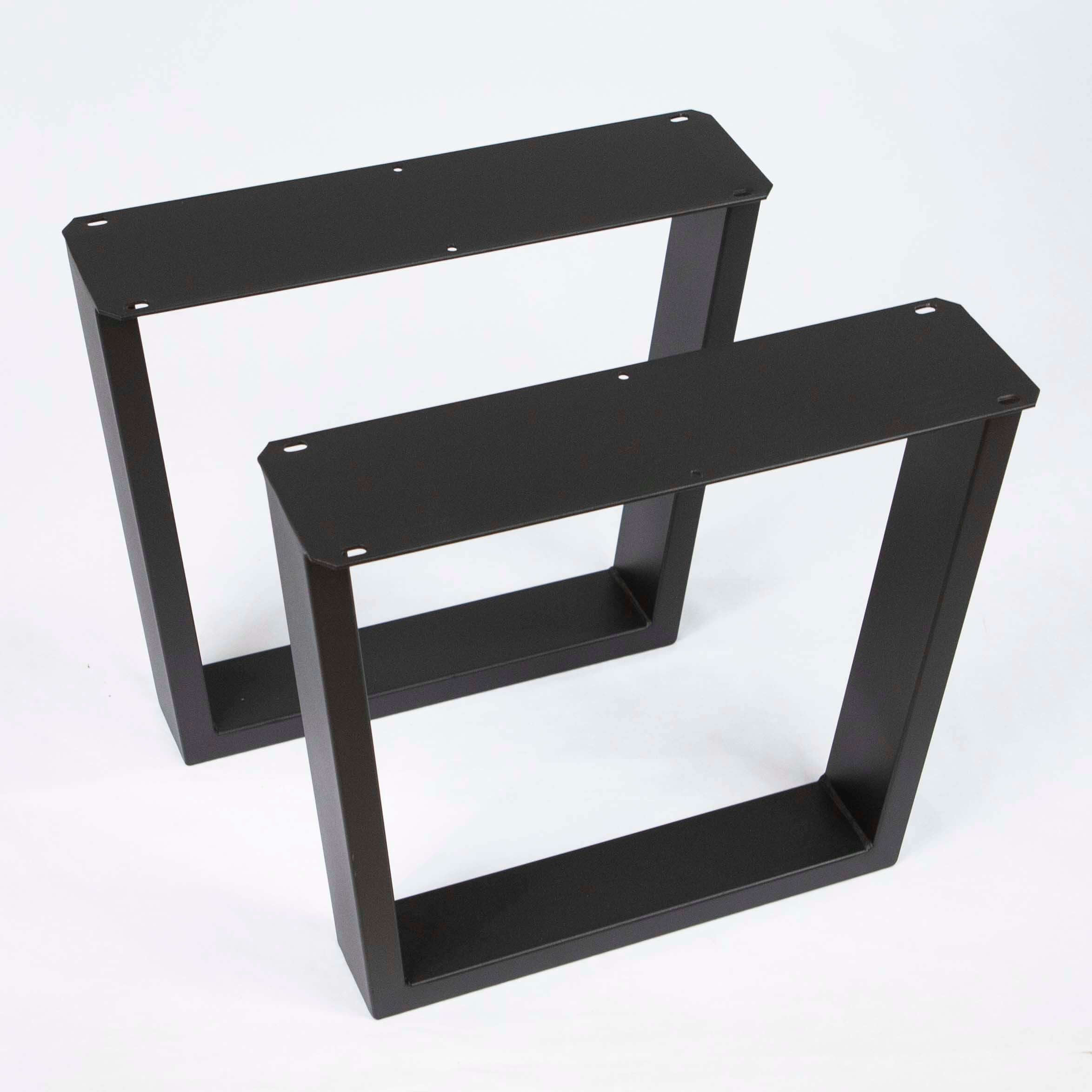Pair of matte black trapezoid coffee table leg frames, angled view with wide top rails