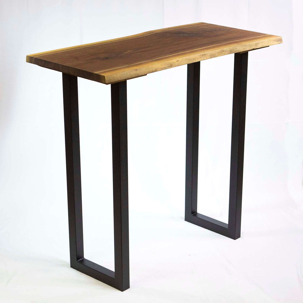 Bar height table U-legs with dark finish, supporting a wood rectangular tabletop