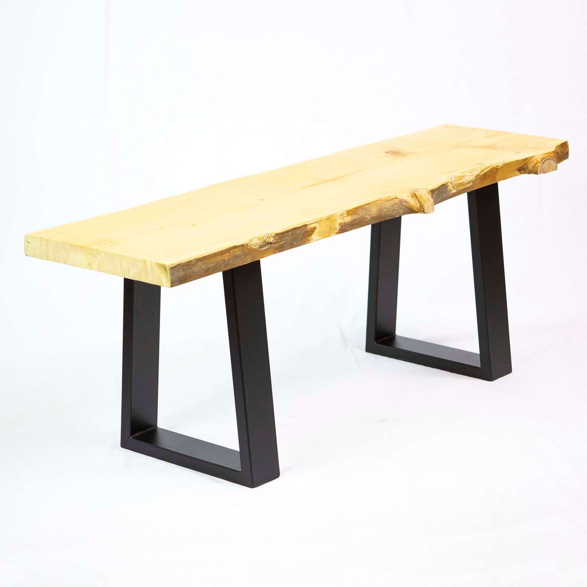 Black trapezoid bench legs with open frame design and screw-mount holes