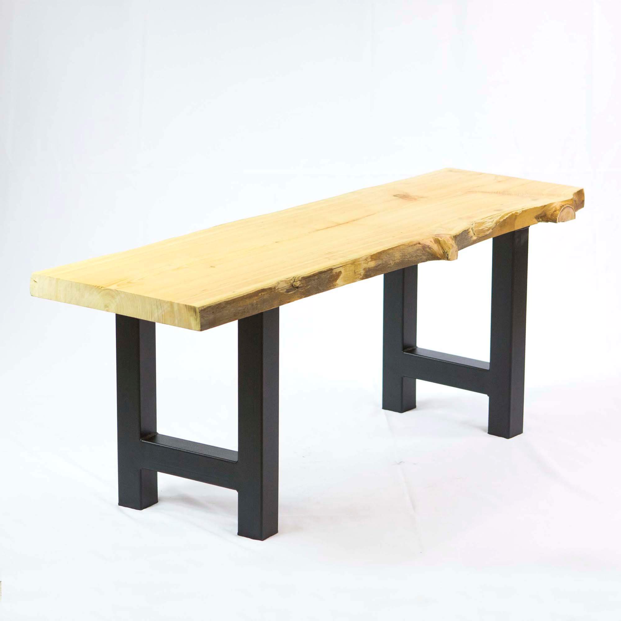 Bench with light wood plank top and dark H-leg supports, open rectangular frame