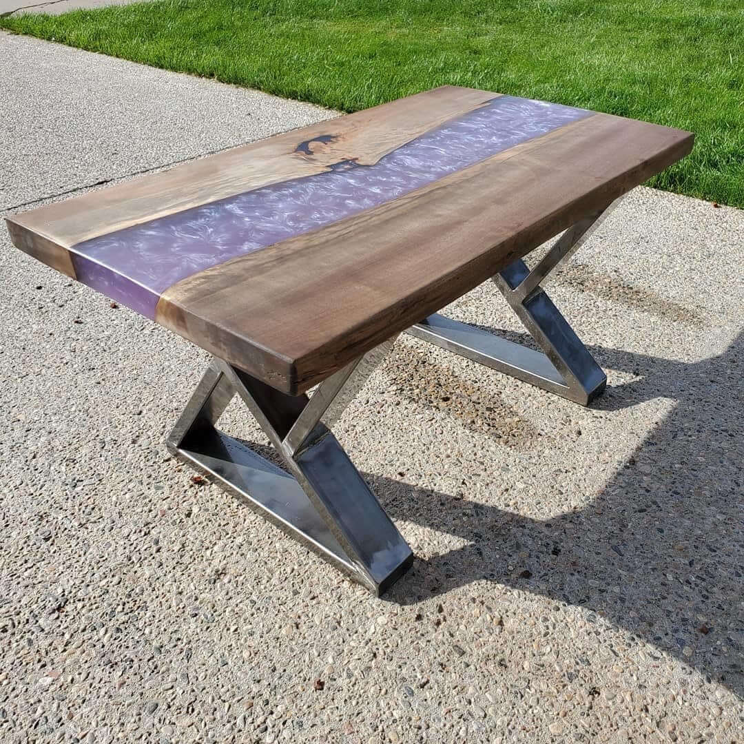 Z-shape coffee table legs, blue metal frames supporting a wooden top