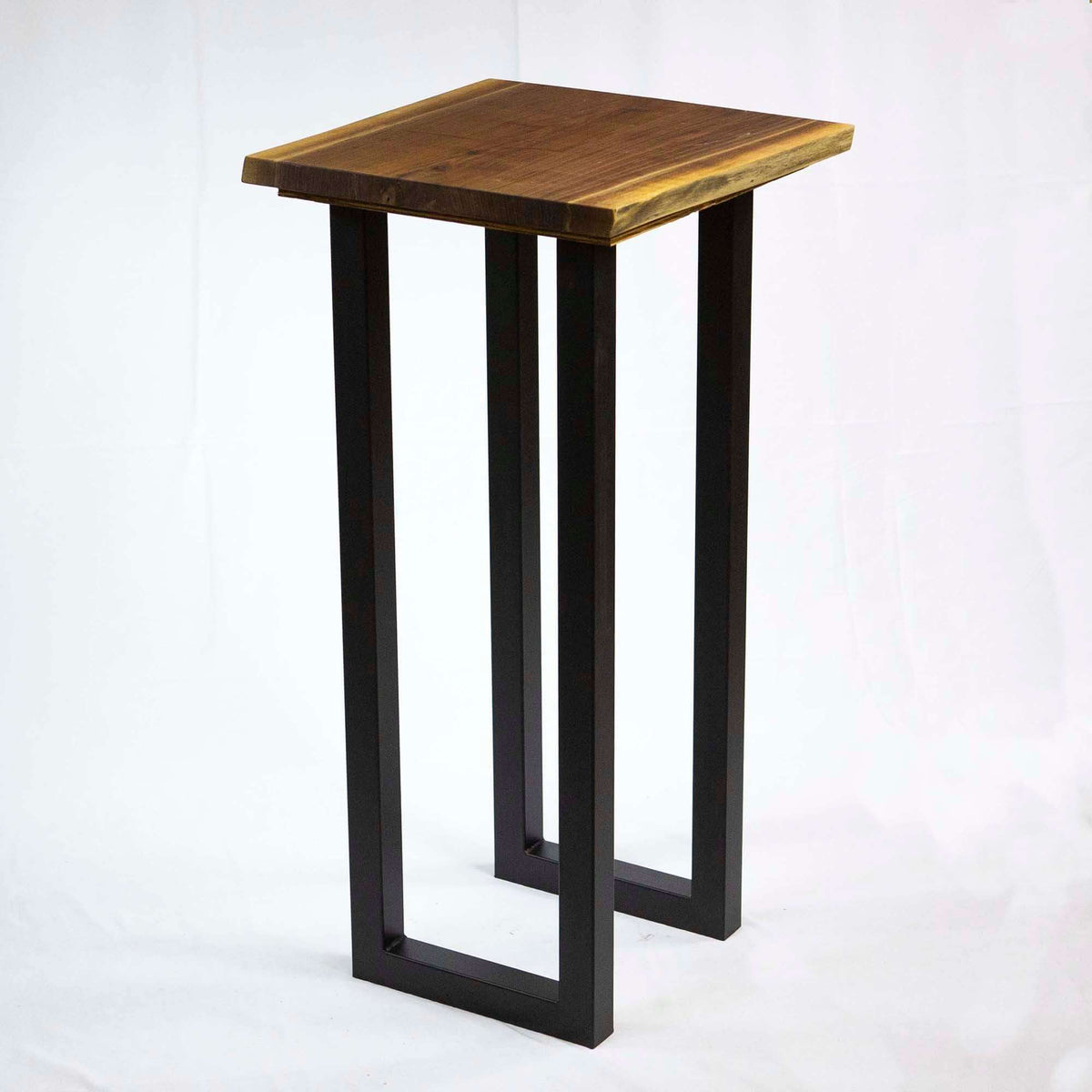 Bar height table U-legs with dark finish and a square wood top panel